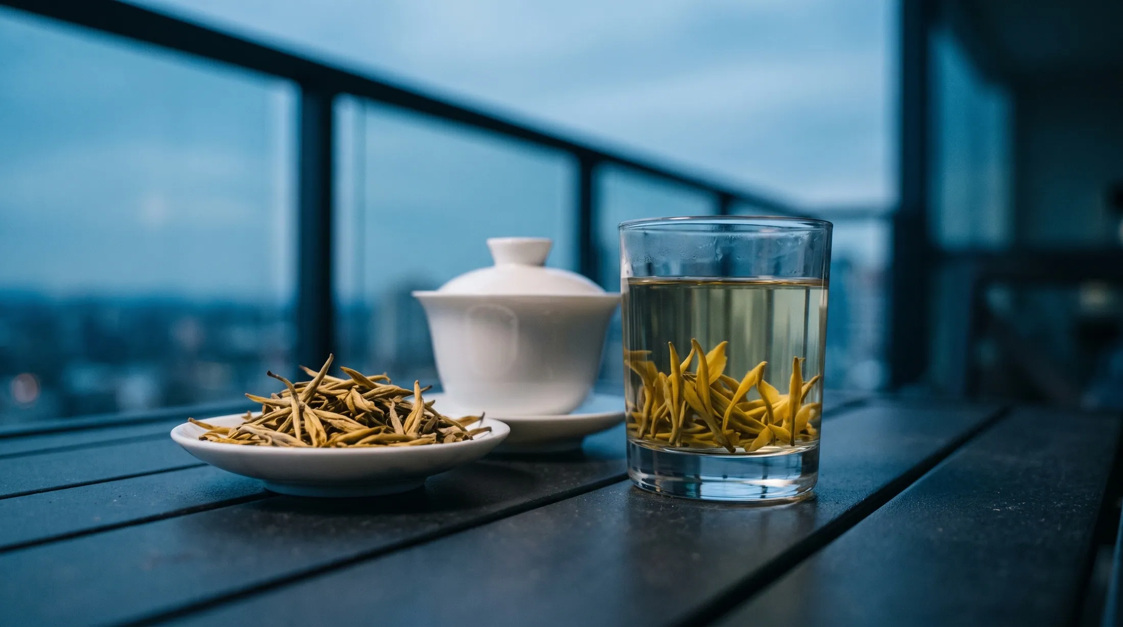 Junshan Yinzhen yellow tea needles standing in a glass